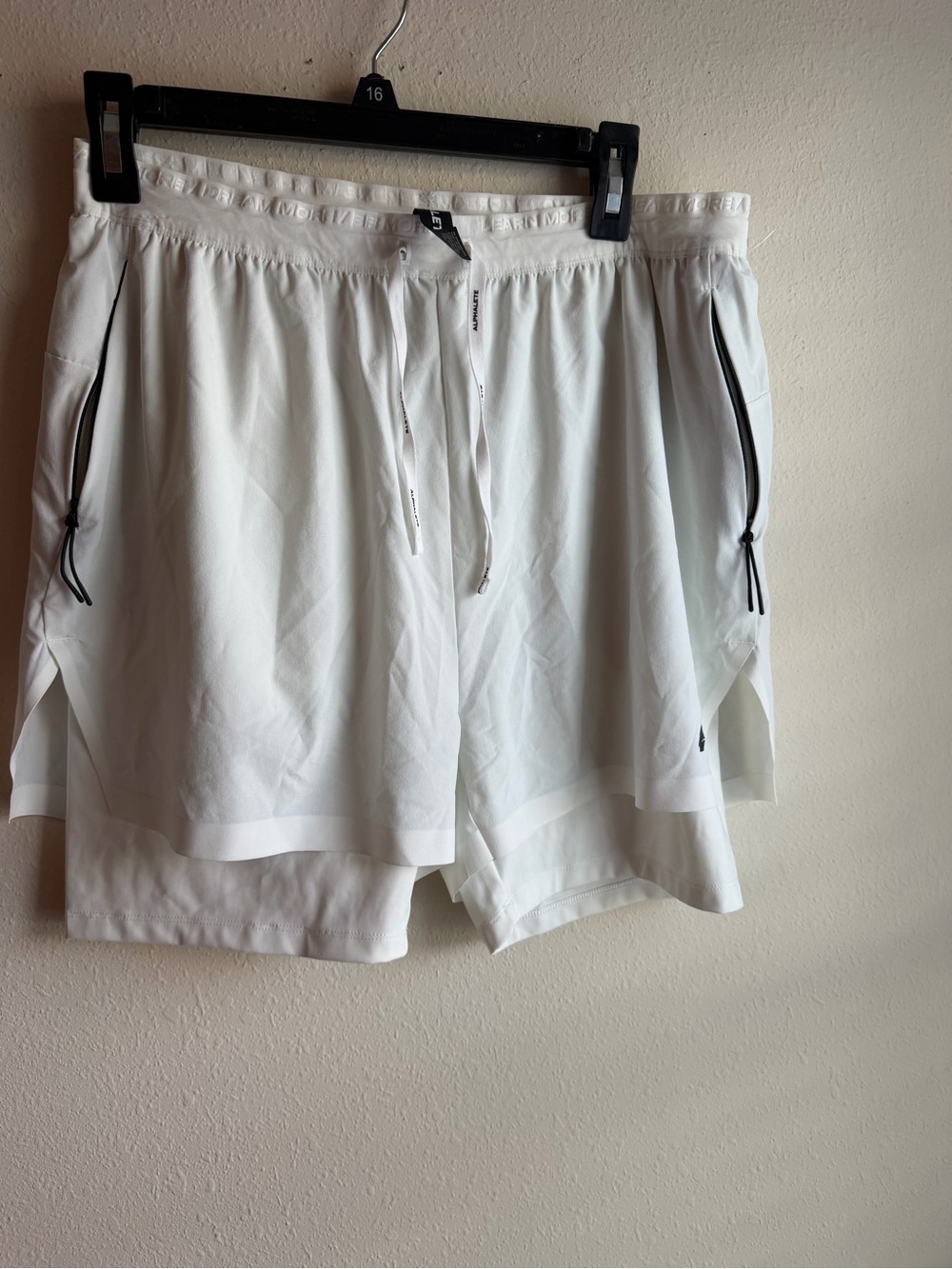 Alphalete White Layered Training Shorts with Black Zip Accents